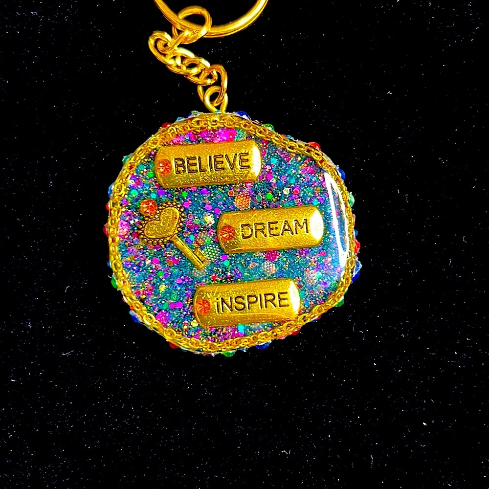 Resin keychain. Gold charms and chain, mixed chunky glitter w/rhinestone trim💛